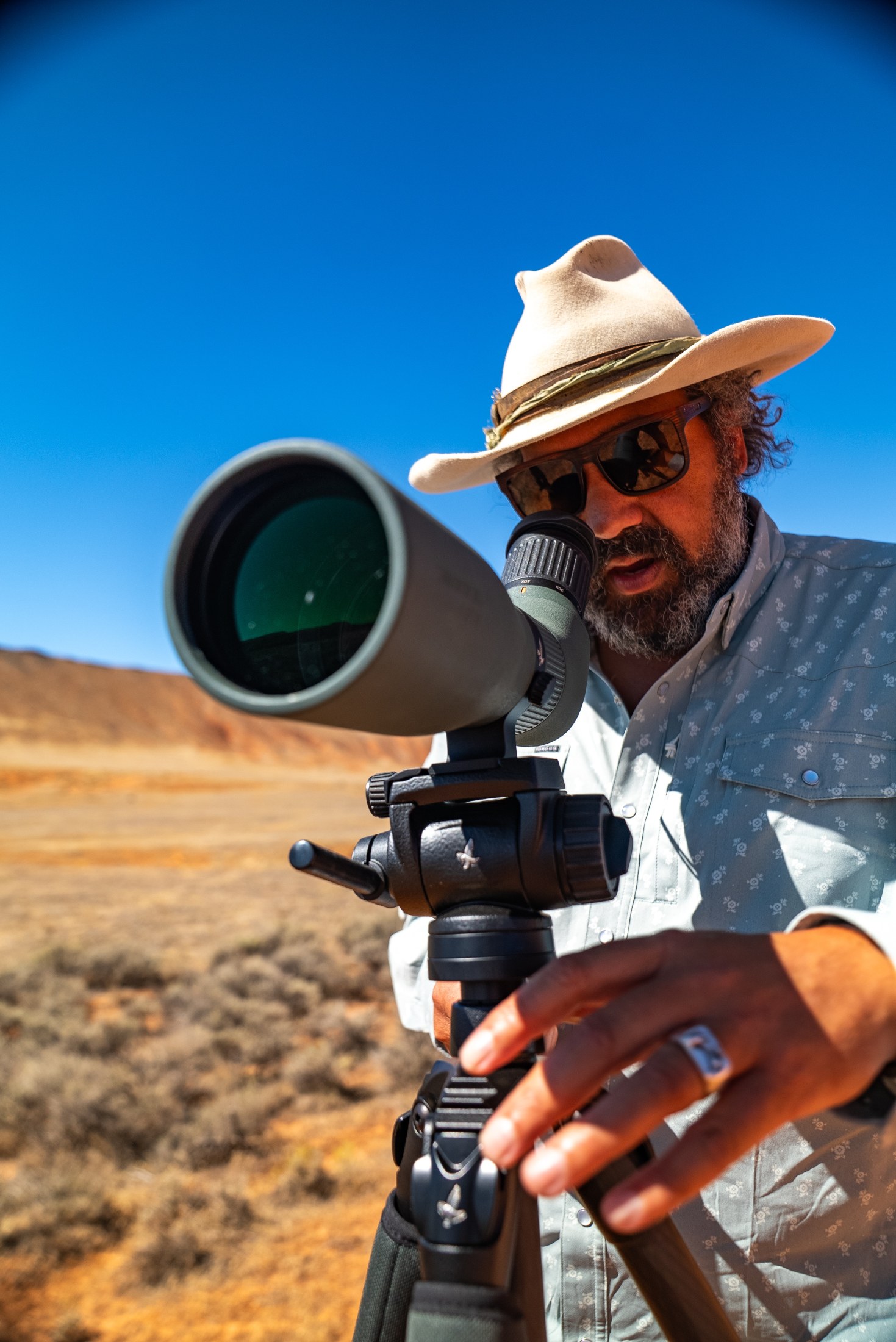 Josh Crumpton at a Swarovski spotting scope on Paintrock Canyon Ranch, Wyoming